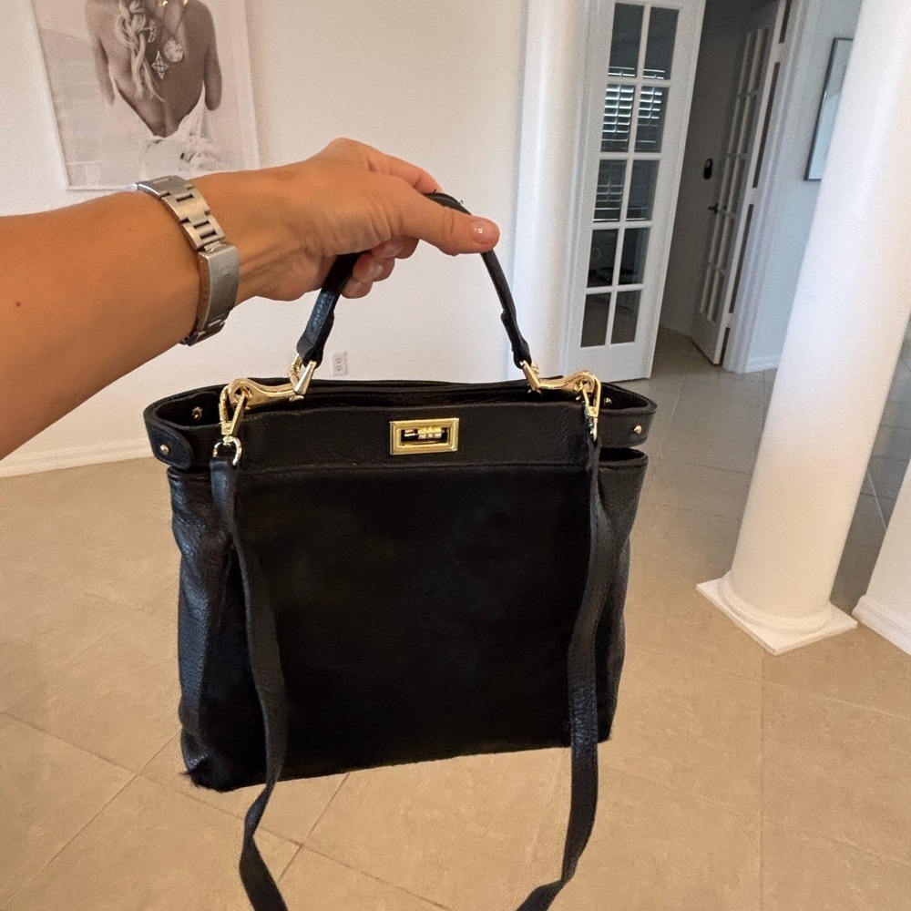 Black gorgeous fax fur soft leather Bag with long strap.